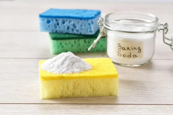 stock image Environmentally friendly detergent - baking soda on a white wooden table.