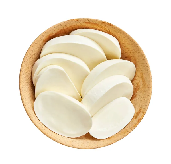 Pieces of mozzarella Buffalo cheese in a wooden bowl isolated on a white background, top view.