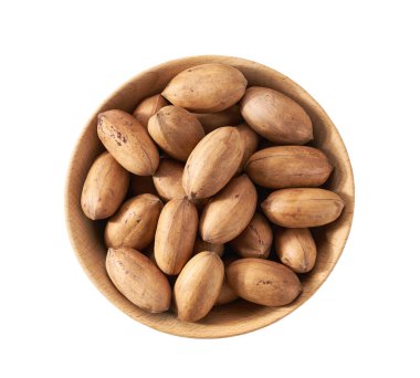 Wooden plate with organic pecan nuts  isolated on white background, top view.