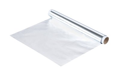 Household aluminium foil for food packaging. Aluminum foil for baking and roasting close-up. Wrapping food foil isolated on a white background.