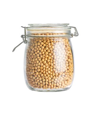 organic soybeans in glass storage jar isolated on white background.