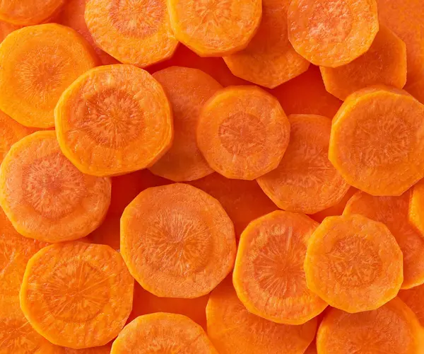 chopped carrot, chopping carrots. cut fresh ripe carrots. cutting carrots. Carrot slice. Sliced carrots. Carrot slices.