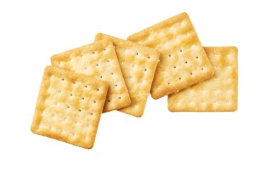 Saltine or square soda cracker isolated on white background, top view.Tasty soup crackers isolated, top view. Soup crackers isolated. Wheat water cracker isolated, top view. clipart