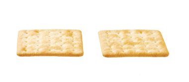 Saltine or square soda cracker isolated on white background.Tasty soup crackers isolated. Soup crackers isolated. Wheat water cracker isolated. clipart