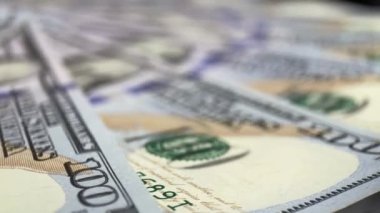 Hundred USD cash macro view. 100 Dollar Cash. Background Bill Sign USA Fiat Money. Hundred Dollar Closeup. Stop Motion Texture of 100 USD Bills. Concept Finance Business Investment.