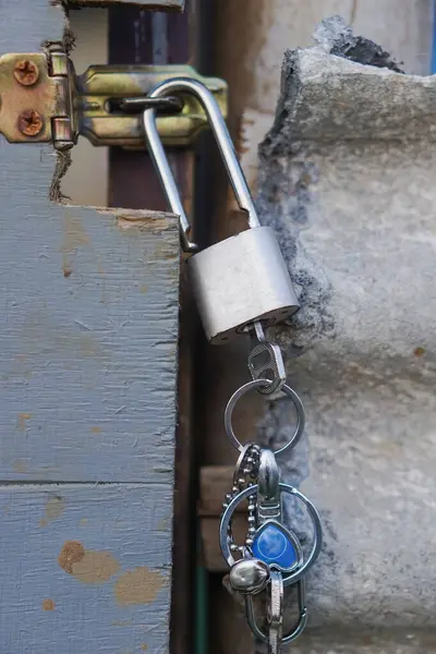 The lock and key that close the door. Lock on field door lock
