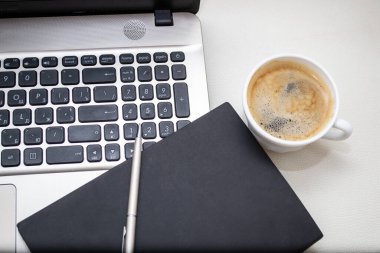 coffee cup and keyboard on a white background