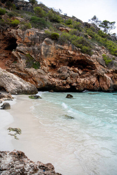 Paradise beach with turquoise water and nature in Calo Des Moro, beautiful bay of Mallorca Spain