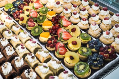 Italian Bakery counter, Window of desserts at a pastry shop. Fresh and tasty products.