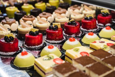 Italian Bakery counter, Window of desserts at a pastry shop. Fresh and tasty products. 