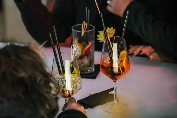 Group Of Friends Enjoying Evening Drinks In Bar.
