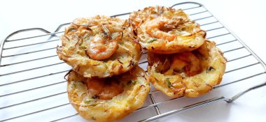 Bakwan udang or shrimp bakwan or bakwan Pontianak. Indonesian fried snack. Traditional street food clipart