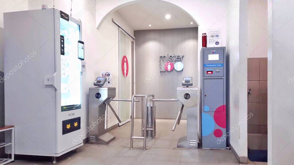 In front of the Mister Loo entrance, premium public toilet facilities in the Tanah Abang shopping center. Jakarta, Indonesia - June 19, 2025