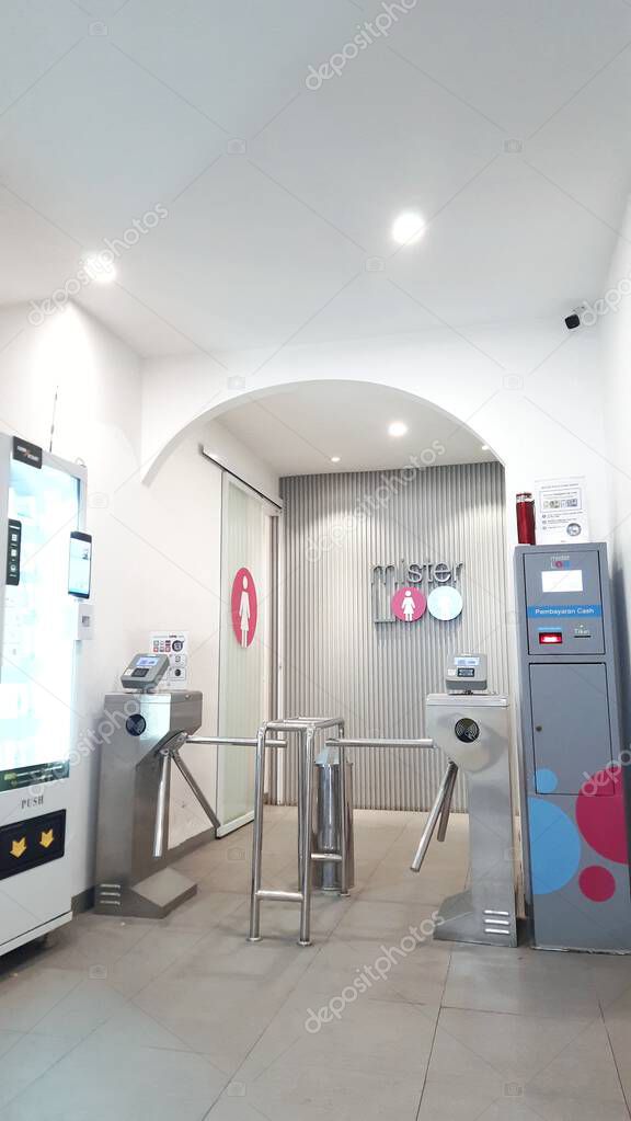 In front of the Mister Loo entrance, premium public toilet facilities in the Tanah Abang shopping center. Jakarta, Indonesia - June 19, 2025