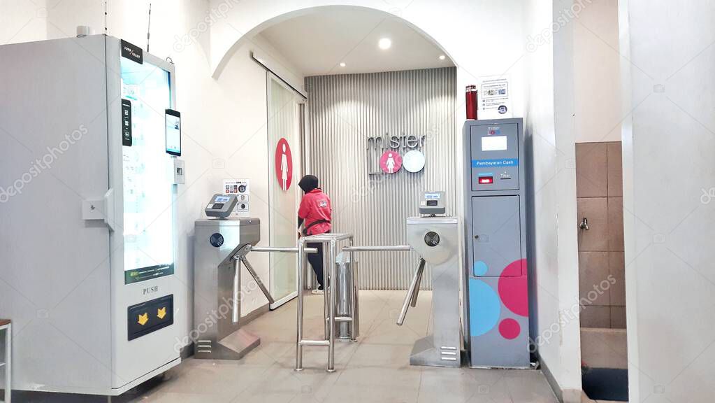 In front of the Mister Loo entrance, premium public toilet facilities in the Tanah Abang shopping center. Jakarta, Indonesia - June 19, 2025