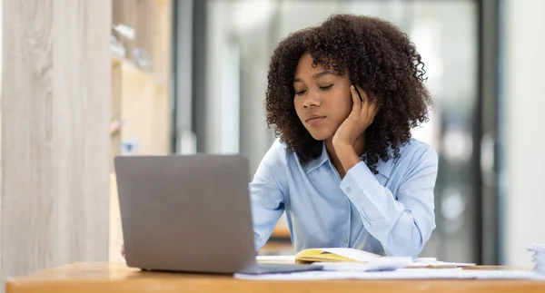 stock image Successful african american accountant business woman work documents tax on laptop computer in office. finance investment economy and marketing research concept.