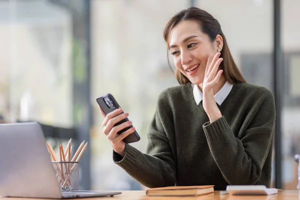 stock image Cheerful Asian business woman work in workspace office. do math finance on wooden desk in office, tax, accounting, financial concept.