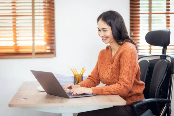 Freelancer Asian businesswoman Accounting work at home using calculating income-expenditure and analyzing real estate investment data report Financial and Documents tax systems concept.