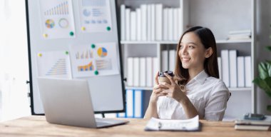 Business woman using calculator for do math finance on desk in Home office, Asian female finance business tax, accounting, statistics and analytic research concept