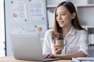 Business woman using calculator for do math finance on desk in Home office, Asian female finance business tax, accounting, statistics and analytic research concept