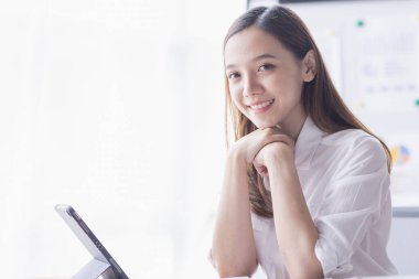 Business woman using calculator for do math finance on desk in Home office, Asian female finance business tax, accounting, statistics and analytic research concept