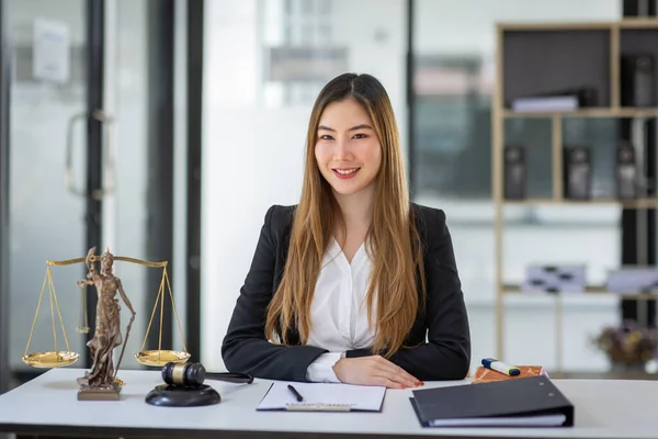 female intelligent law attorney lawyers working at the law firms. Judge gavel with scales of justice. defense lawyer for justice at the office, Legal law, lawyer, advice and justice concept.