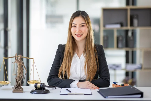 female intelligent law attorney lawyers working at the law firms. Judge gavel with scales of justice. defense lawyer for justice at the office, Legal law, lawyer, advice and justice concept.