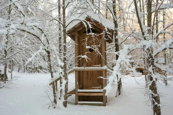 stock image Wooden toilet in the nature park in winter time, Very cold winter, lots of snow.