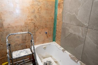 bathroom renovation. The tiles have been removed, the walls are ready for repair. new bath.