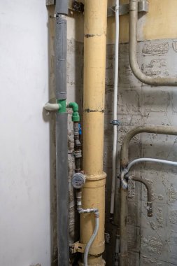 Plumbing system in old premises. Water drainage circuit, Plumbing problems, Works related to leaking faucet, Dark tone, Selective focus