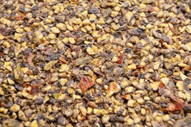 A mixture of various crushed peppers for the preparation of delicious dishes.