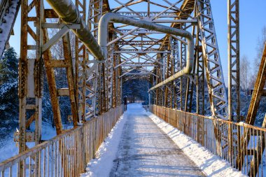 Valmiera bridge in winter. Latvian city bridge. The old railway bridge is no longer in use. Valmiera's famous tourist attraction