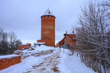 Medieval Turaida Castle complex in winter. Red brick buildings. in the Vidzeme region of Latvia. Gaujas national park