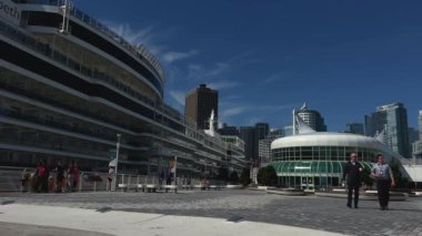 Canada Place place in Vancouver The huge ship Queen Elizabeth to the shore of Vancouver Sails and buildings also a white ship just looks great against of blue sky and the sea Canada Vancouver 07.2022