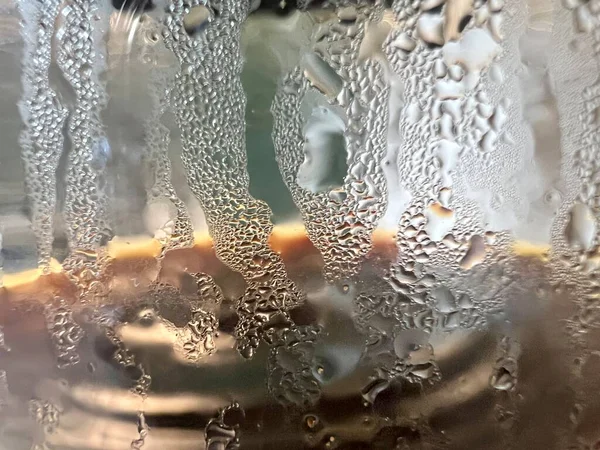 stock image Sausage coffee hot coffee misted glass Dripping Condensation, Water Drops Background Rain drop Condensation Texture. Close up for misted glass with droplets of water draining down . High quality photo