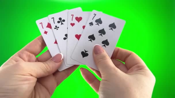 Hand Holding Four Sevens Green Background Close Female Hands French — Wideo stockowe