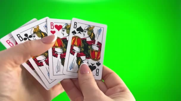 Hand Holding Four Jack Card Green Background Close Female Hands — Vídeo de Stock