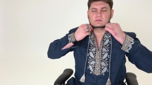 Adult Male Ukrainian Kozak Embroidered Shirt Straightens Collar Fastens Buttons — Vídeo de stock