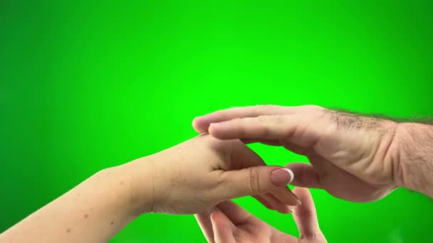 Woman Gives Hand Man Man Strokes Her Green Background Chromakey — Vídeos de Stock