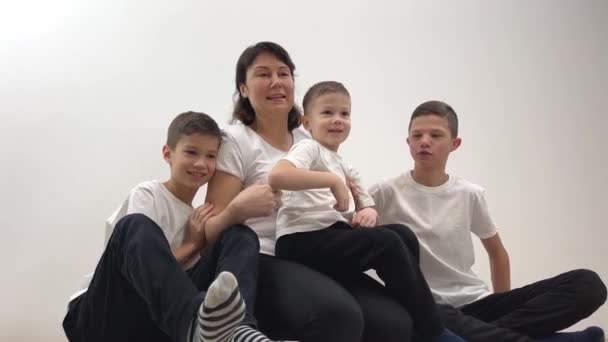 Mother Three Sons Happy Mother Hugging Three Cute Little Kids — Wideo stockowe