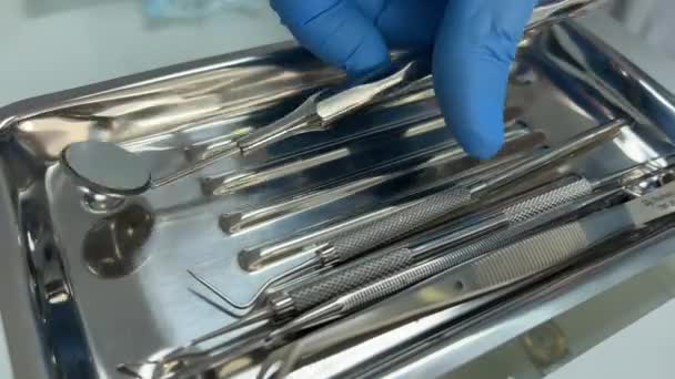 Unrecognizable Dentist Doctor Blue Sterile Glove Holding Dental Tools Hand — Stok video
