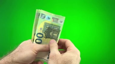 Woman hands counting euro cash money Green chroma key background for a woman french manicure. High quality 4k footage