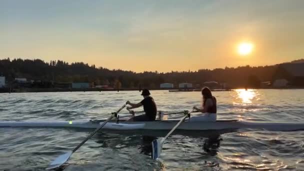 Sunset Waves Children Sailing Boat Rowing Girl Sitting Rowing Boy — Stockvideo