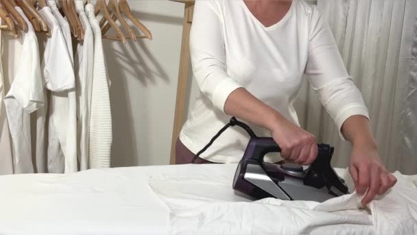 Woman Hand Ironing Clothes Isolated Woman Shirt Ironing While Working — Stockvideo