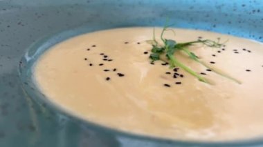 Bowl of creamy potato soup on wooden plate Greek traditional cuisine Tzatziki with cucmber and dill. High quality photo