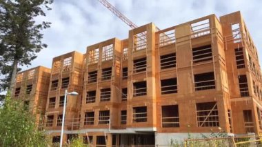 building construction in canada vancouver wooden house frame unfinished construction thin walls crane summer housing preparation refugee housing abandoned house