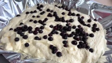 Rotating Berry Pie On Wooden Plate On Turntable Homemade pastry blueberry pie with yogurt. Traditional american dessert. Flat lay food background. Top view 4k footage. Forest berry tart