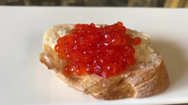 Womans Hand Takes Sandwich Red Caviar White Plate Sandwiches Red — Video Stock