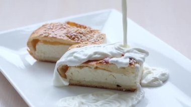 cottage cheese dessert poured with plenty of sour cream with rustic dessert, delicious food healthy food, sour cream and homemade cottage cheese Who has a cow Home cooked delicious
