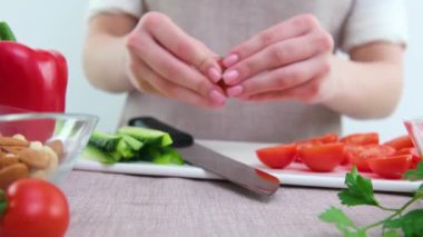 big board banner for advertising beautiful young woman prepares a vegetable salad in the kitchen. Healthy eating. Vegan salad. Diet. The concept of diet. Healthy lifestyle. We cook at home.